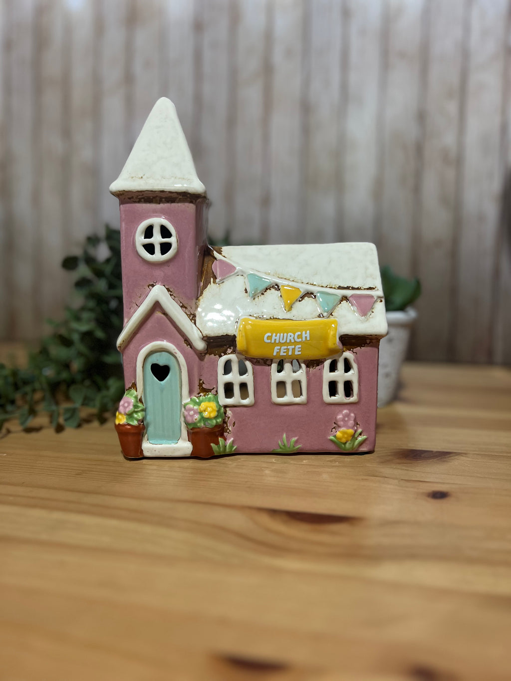 Ceramic Church Themed Tea Light with the Words Church Fete on it in a Pink and White Colour