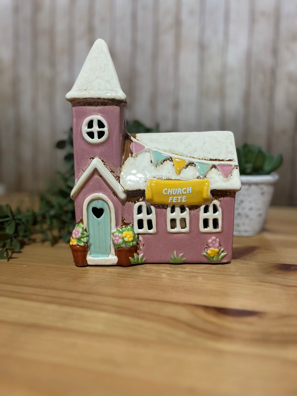 Ceramic Church Themed Tea Light with the Words Church Fete on it in a Pink and White Colour