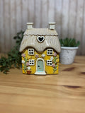 Yellow Heart House Covered in Daisies with Thatched Roof Detail, Tea Light Holder
