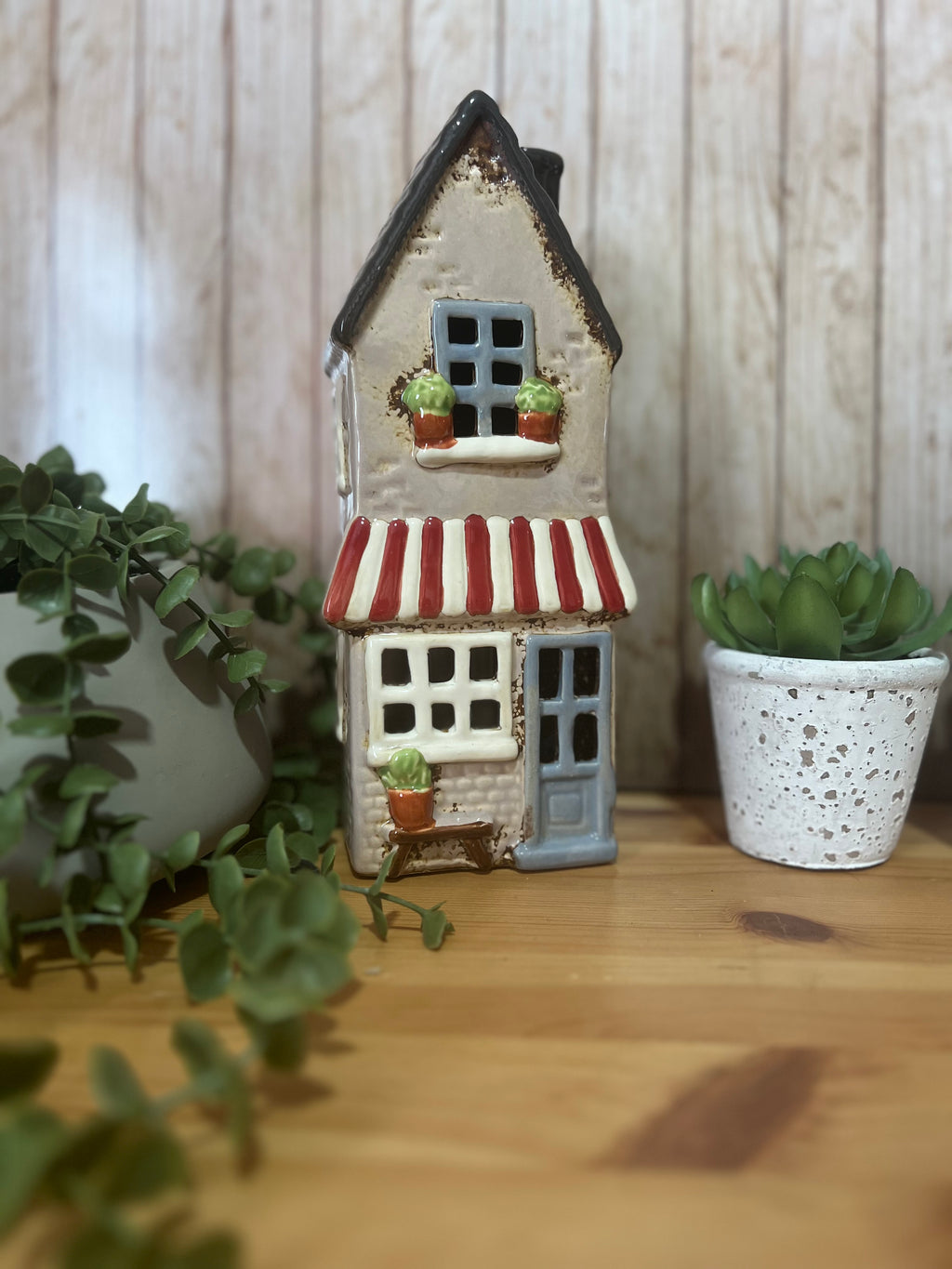 Tall Glazed Ceramic House with Bench, Pot Plants and Awning