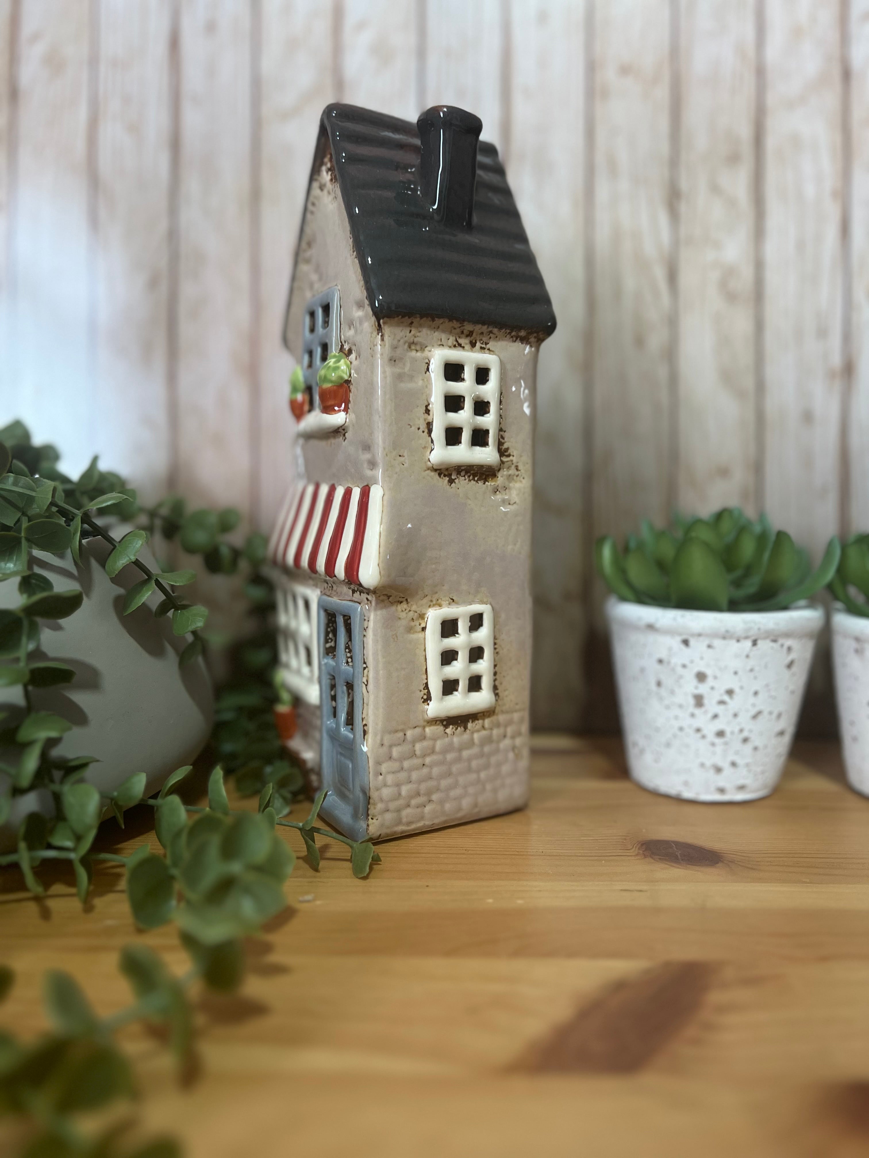 Tall Glazed Ceramic House with Bench, Pot Plants and Awning